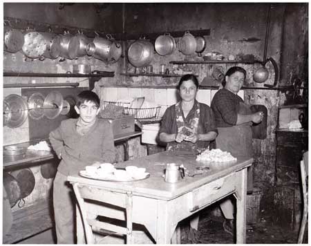 Women with plateful of garlic at orphanage. Photo by Mike Stiles, USN, collection of Stoney Compton